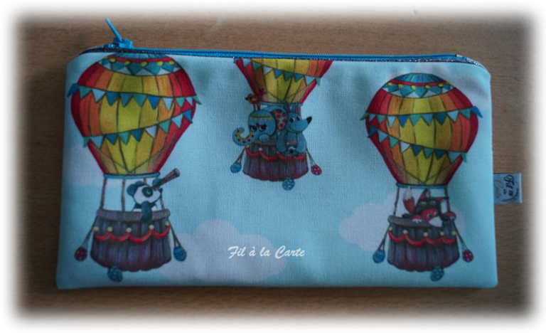 Trousse ballon passepoilée